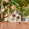 Glitzhome&#xAE; 10.5&#x22; White Distressed Wood Birdhouse with Flowers